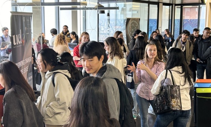 Students networking at the society fair